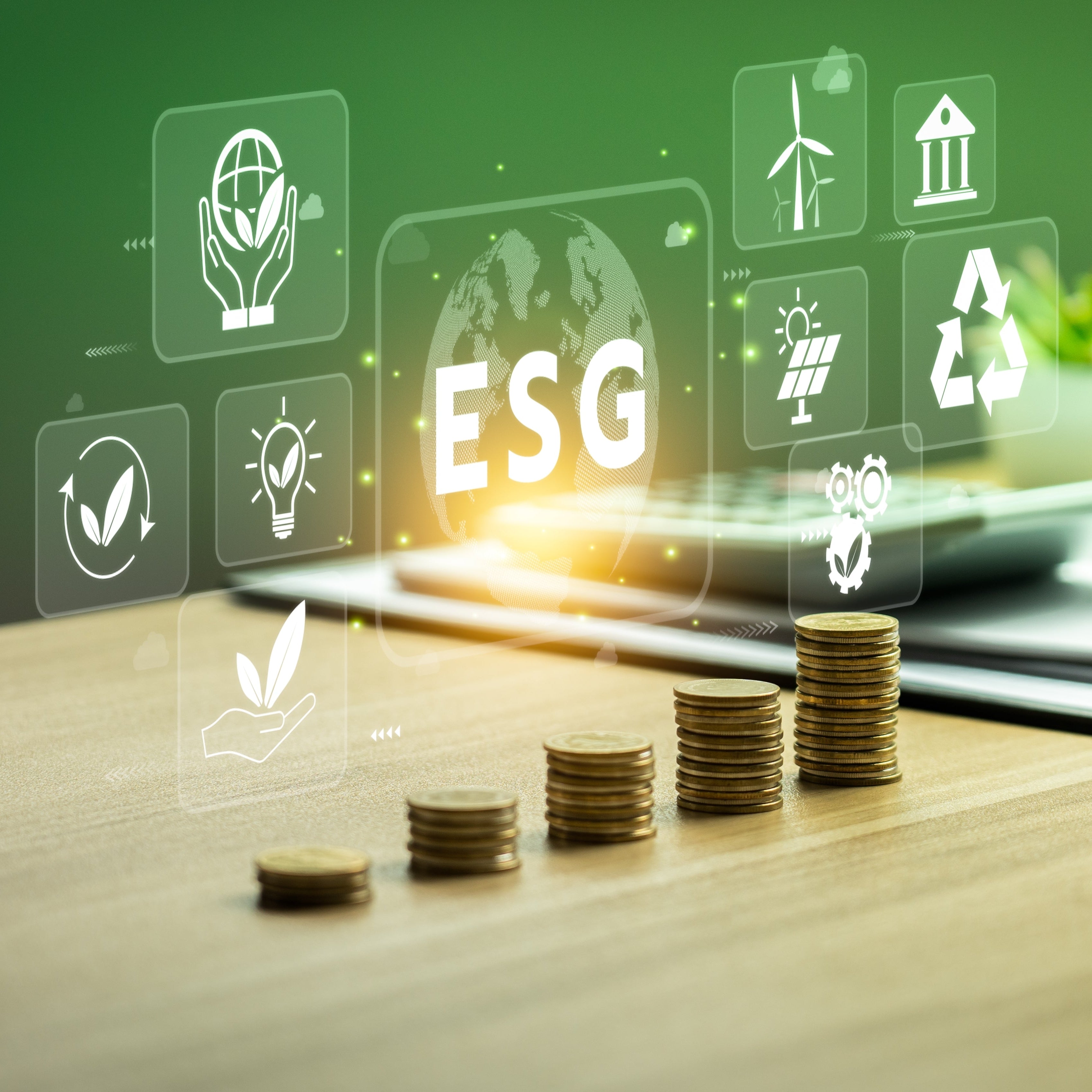 Stacks of coins on a desk with ESG icons 