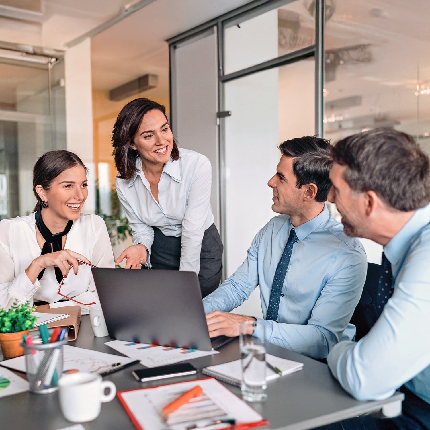 Four professionals in a meeting in the office
