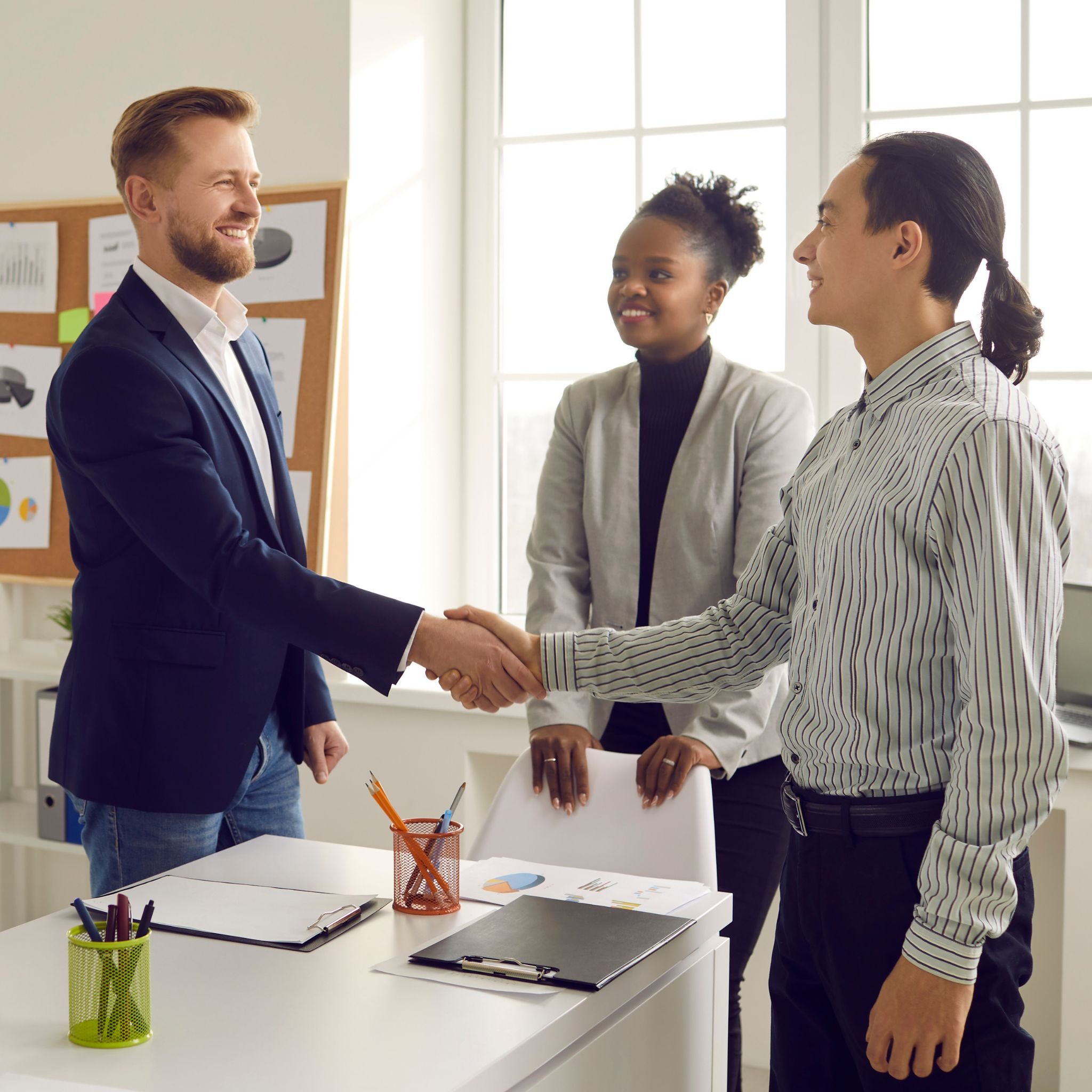 Two men shaking hands in the office