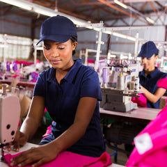Woman working on a sewing machine in the factory